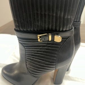 Vince Camuto Black Leather Quilted just above the ankle boot. With gold buckle.